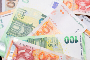 Euro banknotes and Croatian Kuna. Concept showing Croatia's accession to the Eurozone