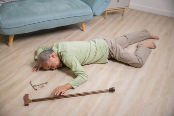Asian elderly man retired headache after fall down, Sick senior old man falling down lying on floor...