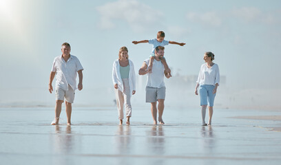 Walking, freedom and big family at the beach for holiday, travel peace and love at the ocean of Spain. Nature summer, happy and parents, child and grandparents on a walk by the sea during a vacation
