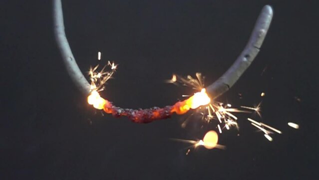 Sparkler pyrotechnics with black background in slow motion 1000 fps. Sparkling new years eve party, festive pyro with sprakling golden effect.