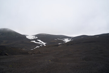 Hiking trail at the foot of Koryaksky volcano. Deserted landscape in the summer time. Kamchatka