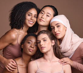 Diversity, beauty and portrait of a group of women in studio for skincare, makeup or cosmetic routine. Feminism, female empowerment and face of multicultural girl friends isolated by brown background