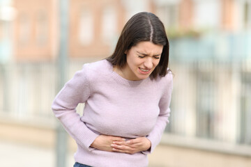 Teen suffering stomach ache