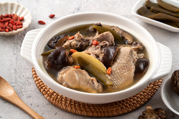 Delicious Taiwanese peeled green chili pepper chicken soup with mushroom and goji berry