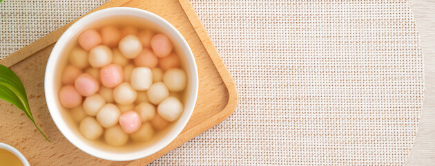 Red and white tangyuan with syrup soup.