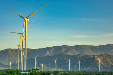 Landscape with Turbine Green Energy Electricity, Windmill for electric power production, Wind turbines generating electricity on rice field at Phan Rang, Ninh Thuan, Vietnam. Clean energy concept. © Nam