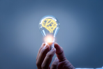 Innovation. Hand holding a light bulb for ideas. New concept with innovation and technology inspiration. Innovation in science and communication concepts, idea ideas. Creativity. Thinking.