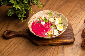 Beet puree soup with avocado and egg