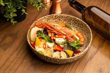 Shrimp salad with berries and cheese