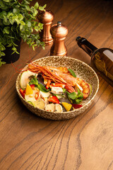 Shrimp salad with berries and cheese