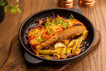 Baked salmon with chips and vegetables