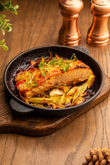 Baked salmon with chips and vegetables