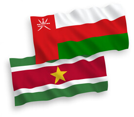 Flags of Sultanate of Oman and Republic of Suriname on a white background