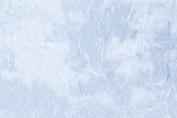 Fototapeta na wymiar 青空を背景に繊維が舞う、むら染めの雲龍和紙