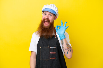 Fishmonger wearing an apron isolated on yellow background showing ok sign with fingers