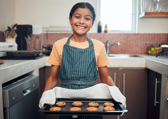 Baking, cookies and girl portrait happy about food, learning and youth helping in the kitchen and...