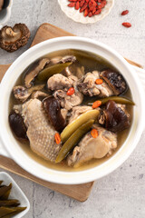 Delicious Taiwanese peeled green chili pepper chicken soup with mushroom and goji berry.