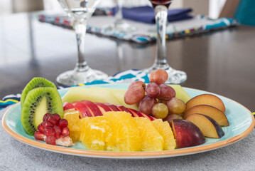 Selection of fruits on a plate in restaurant