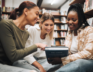 Student, friends and book in school library for education, learning or knowledge together at university. Students smile for book club, books or information for research assignment or group project