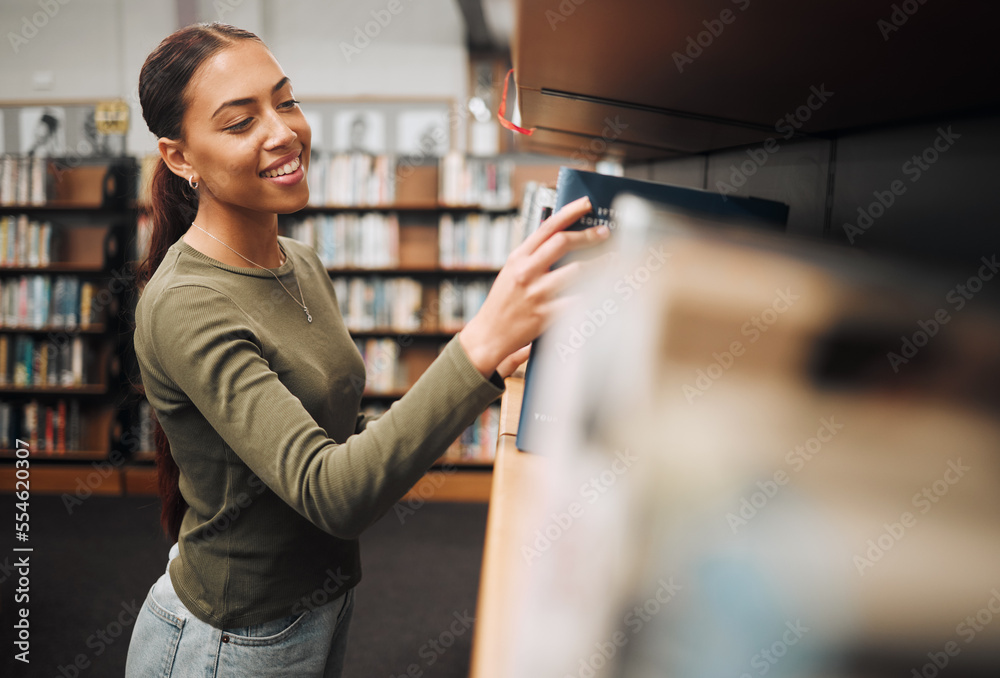 Wall mural Student search bookshelf for books in library for education, knowledge and learning about history, philosophy and language study. Happy woman with book for reading, studying and project research