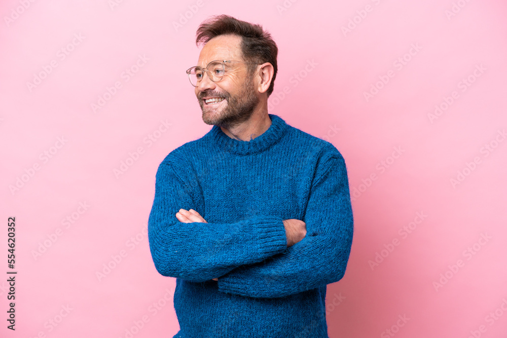 Wall mural Middle age caucasian man isolated on pink background happy and smiling