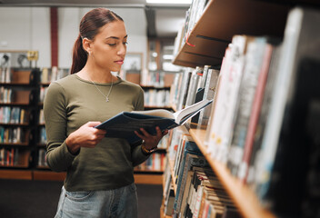 Black woman reading book in a library for education, studying and research in school, university or college campus. Focus, book and student at bookshelf for language learning or philosophy knowledge - obrazy, fototapety, plakaty