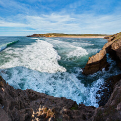 Summer Atlantic ocean coast landscape and Amoreira beach (Aljezur, Algarve, Portugal).
