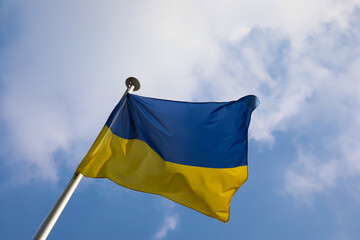 yellow and blue flag of Ukraine and clouds