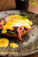 Salmon toast with poached egg and hollandaise sauce