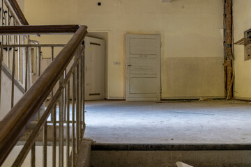 A staircase in an old abandoned psychiatric hospital.