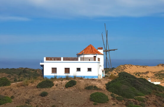 Beautiful Carrapateira windmill at the west Algarve coast of Portugal at praia da Bordeira