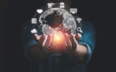 Businessman holding virtual world with icons for global data information technology exchange and innovation transformation concept.