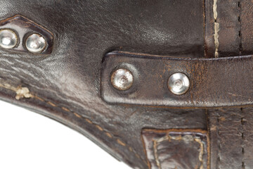 Leather product with rivets and seam.