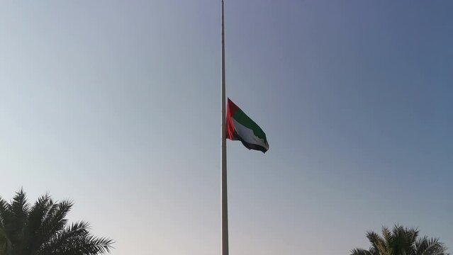 UAE national flag fly at half mast. The Flag half-mast as a sign of mourning.Commemoration Day concept
