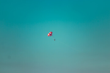 Parasailing: being attached to a string