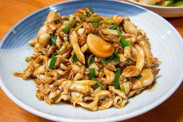 A delicious Chinese dish, fried razor clams in sauce