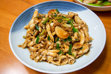 A delicious Chinese dish, fried razor clams in sauce
