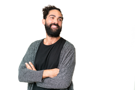 Young man with beard over isolated chroma key background with arms crossed and happy