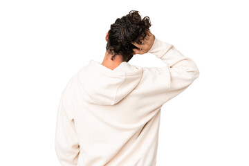 Young man with beard over isolated chroma key background in back position and thinking