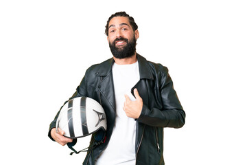 Young man with beard with a motorcycle helmet over isolated chroma key background with surprise facial expression