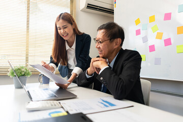 Business partnership concept, Businesswoman pointing at document to presenting project to senior