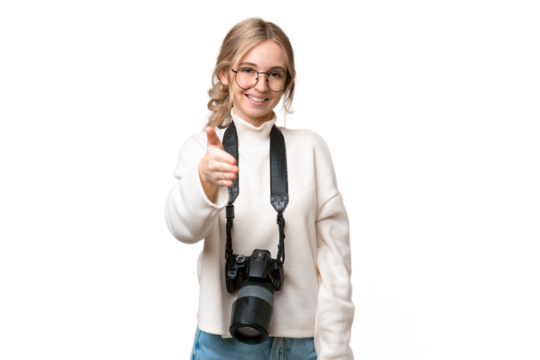 Young photographer English woman over isolated background shaking hands for closing a good deal