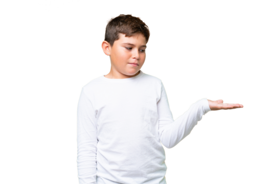 Little caucasian kid over isolated chroma key background holding copyspace with doubts