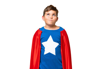 Super Hero caucasian kid over isolated chroma key background and looking up © luismolinero
