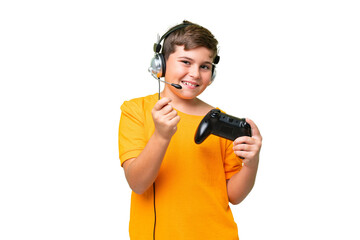 Little caucasian kid playing with a video game controller over isolated chroma key background...
