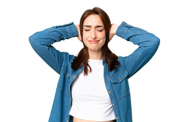 Young caucasian woman over isolated chroma key background frustrated and covering ears