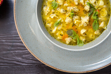 Homemade meat or chicken vegetable soup, top view