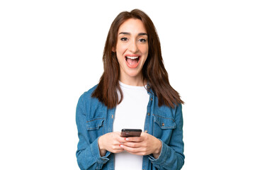 Fototapeta premium Young caucasian woman over isolated chroma key background surprised and sending a message