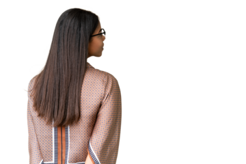 Young African American woman over isolated chroma key background in back position and looking back