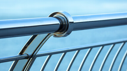 handrail railing made of stainless material close-up near the river embankment. industrial city infrastructure